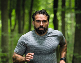 SAS: Who Dares Wins host running through the woods